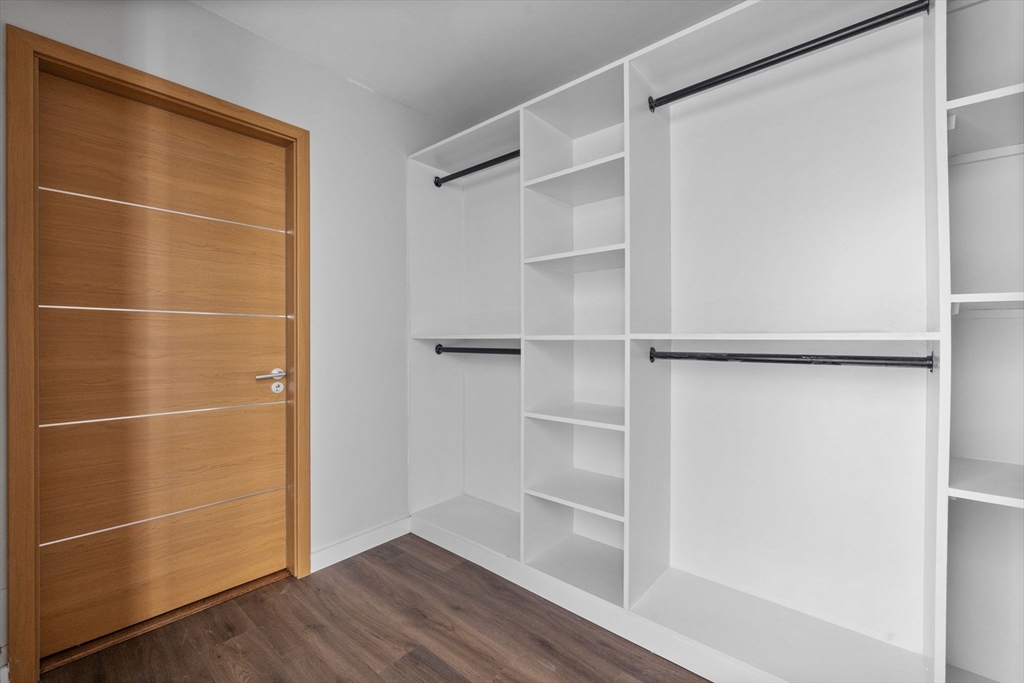 33 Copeland Street, Unit CC Boston, MA 02119 - Photo 16 of 22 a view of a room with wooden floor