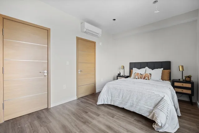 a bedroom with a bed and a closet