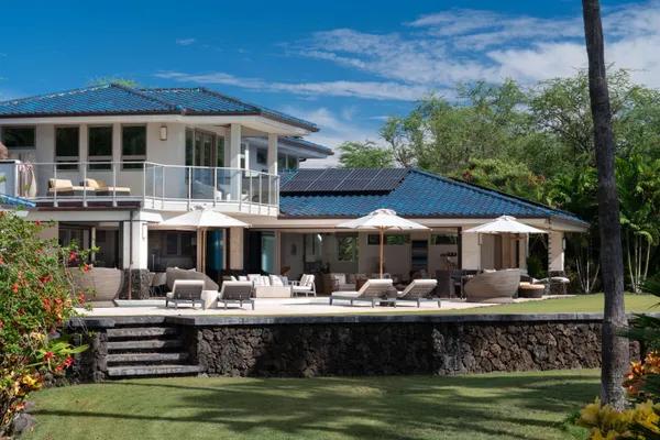 a view of a swimming pool with outdoor seating
