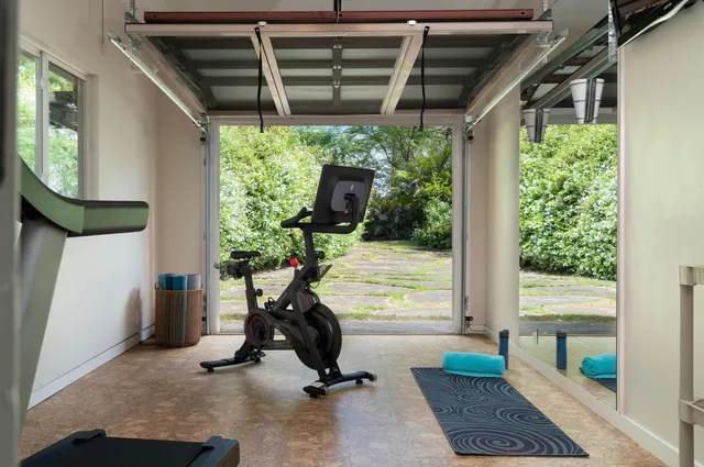 a table and chairs under an umbrella