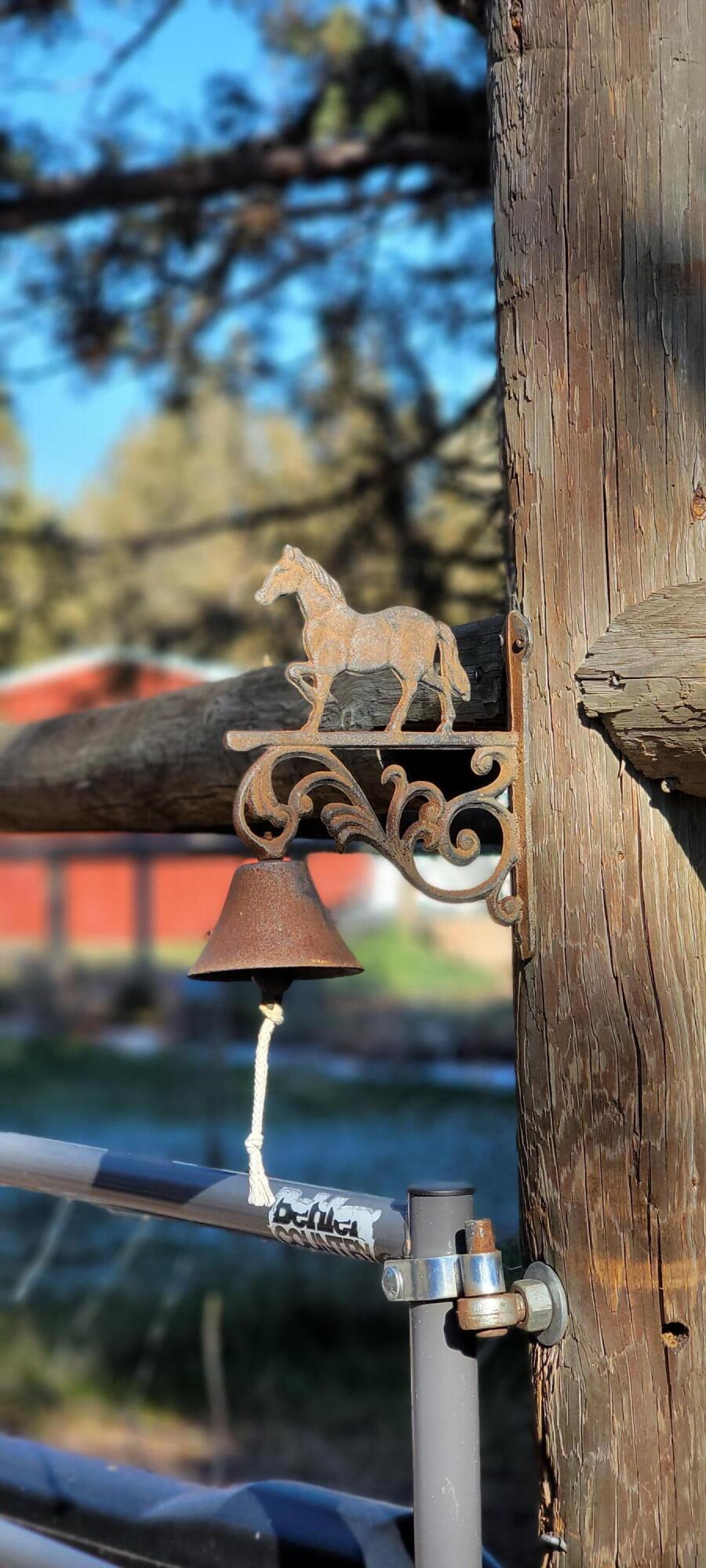 64570 Research Road Bend, OR 97703 - Photo 57 of 60 horse & bell on front gate