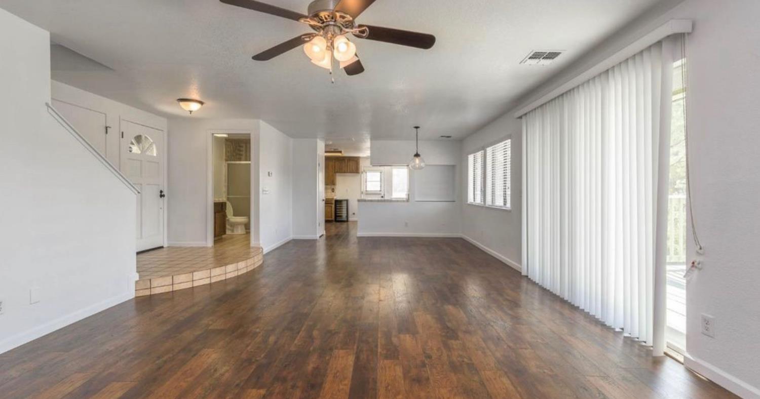 27817 Sky Harbour Road Friant, CA 93626 - Photo 7 of 30 Living room leading into dinning room and kitchen