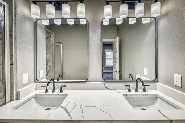 a kitchen with stainless steel appliances granite countertop a stove a microwave and a sink