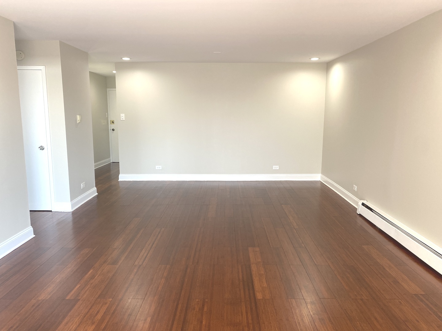 1567 Ridge Avenue, Unit 803 Evanston, IL 60201 - Photo 3 of 9 a view of wooden floor and windows in an empty room