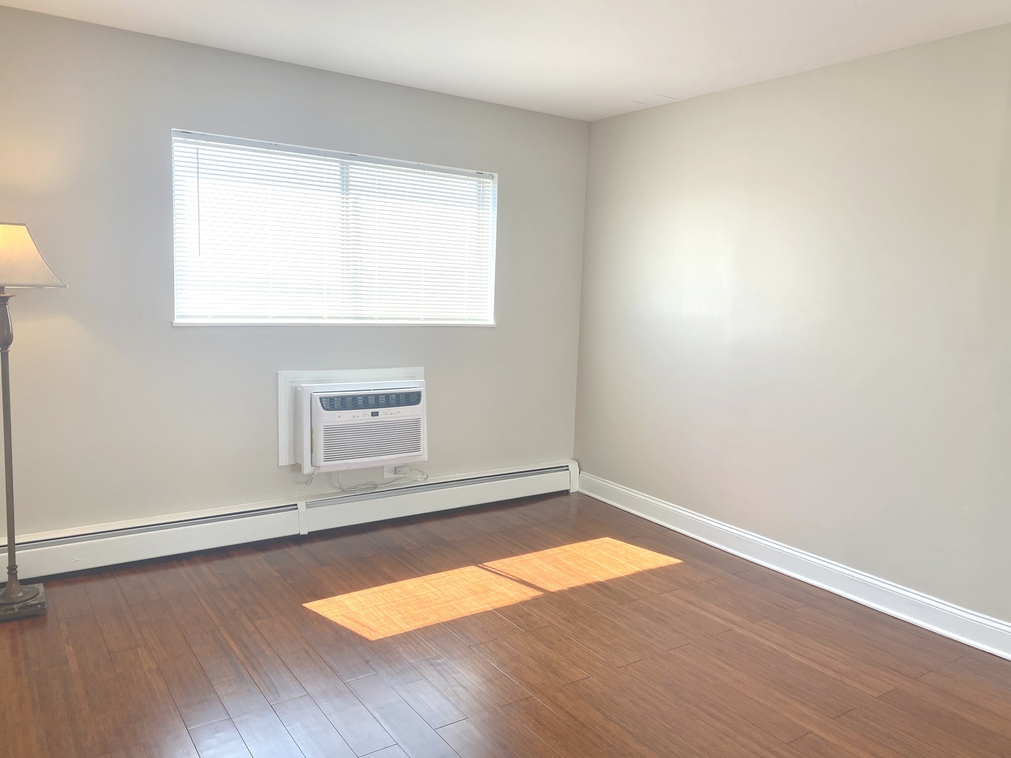 1567 Ridge Avenue, Unit 803 Evanston, IL 60201 - Photo 6 of 9 an empty room with wooden floor and windows