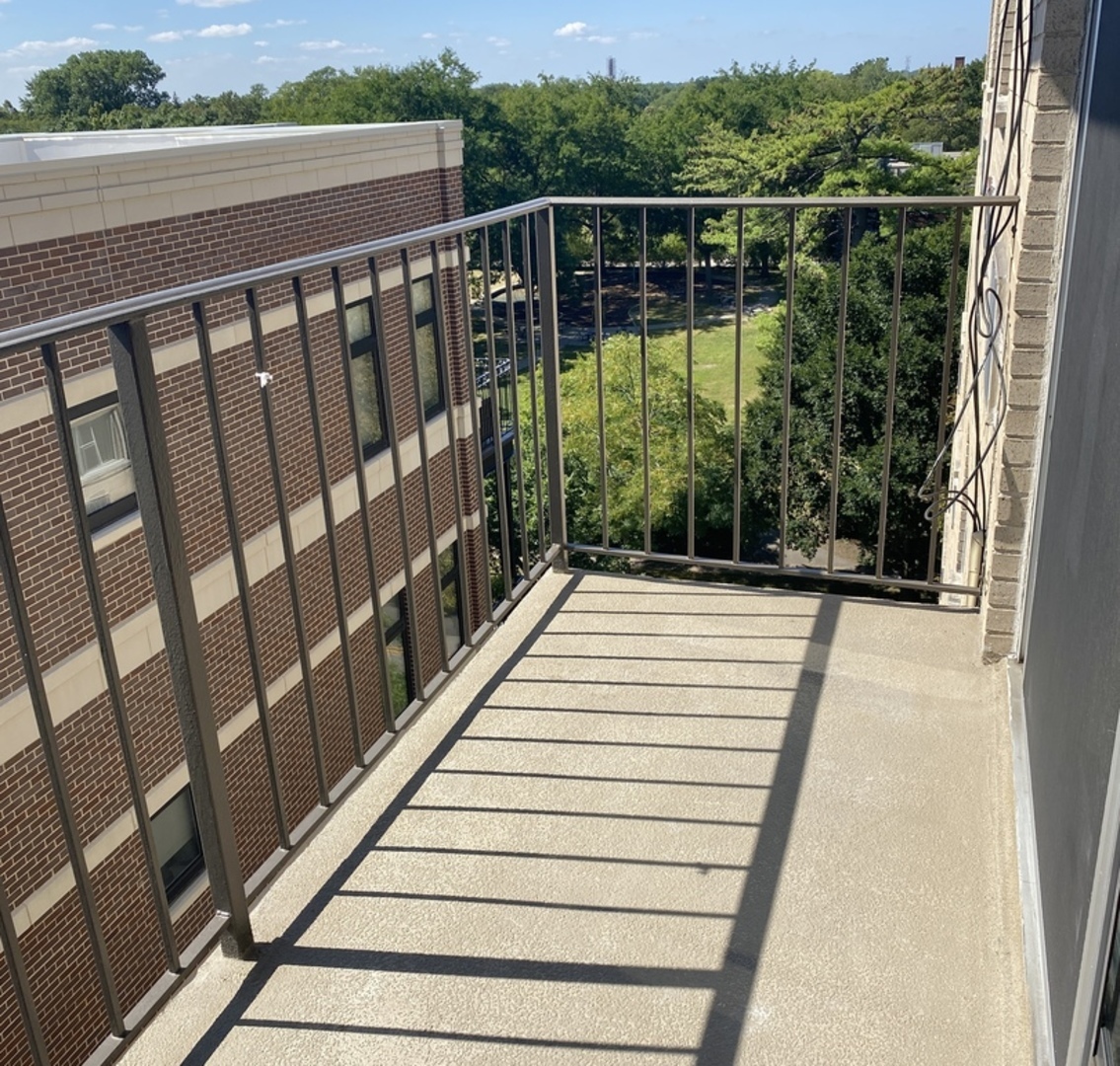 1567 Ridge Avenue, Unit 803 Evanston, IL 60201 - Photo 8 of 9 a view of balcony with wooden floor and fence