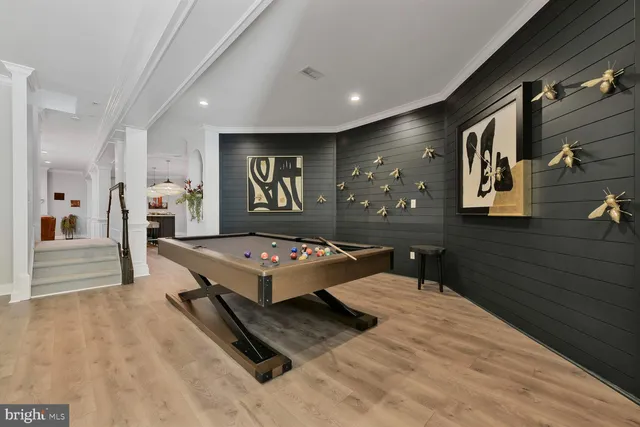 a living room with patio furniture and a large window