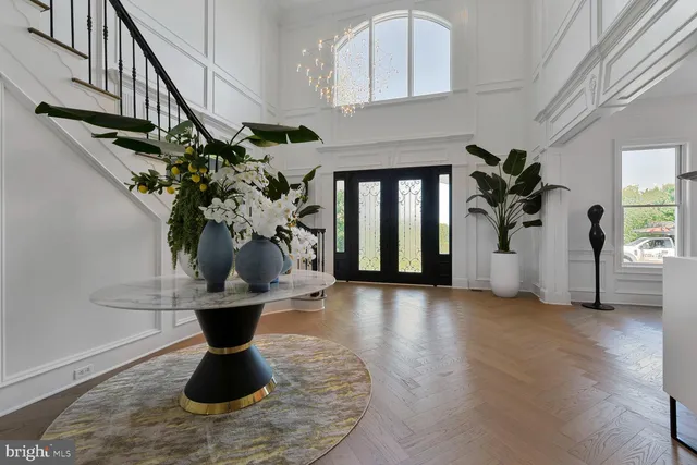 a large kitchen with a table and chairs in it