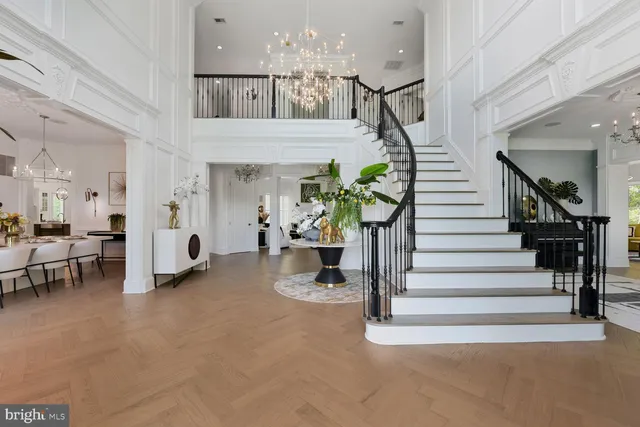 a large kitchen with a table and chairs in it