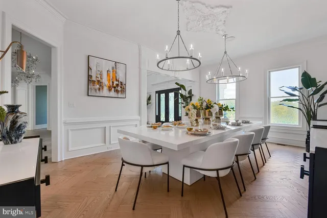 a spacious bathroom with a double vanity sink a mirror and a bathtub