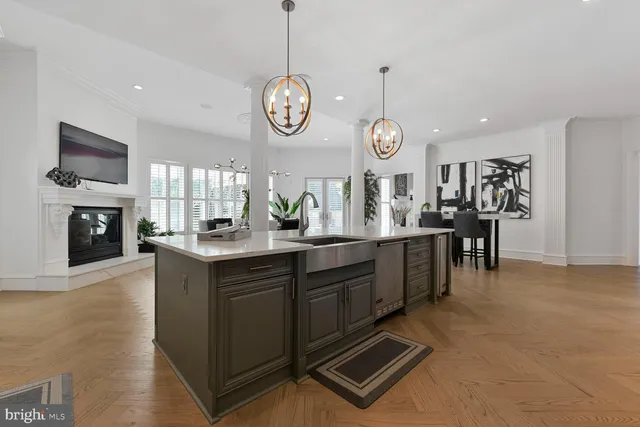 a bedroom with a large bed and a flat tv screen on dresser