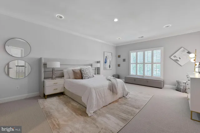a living room with furniture a table and wooden floor