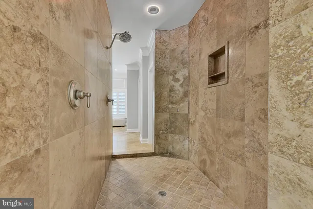 a view of a patio with couches and potted plants
