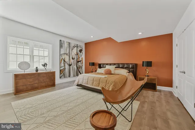 a living room with furniture a rug and a fireplace