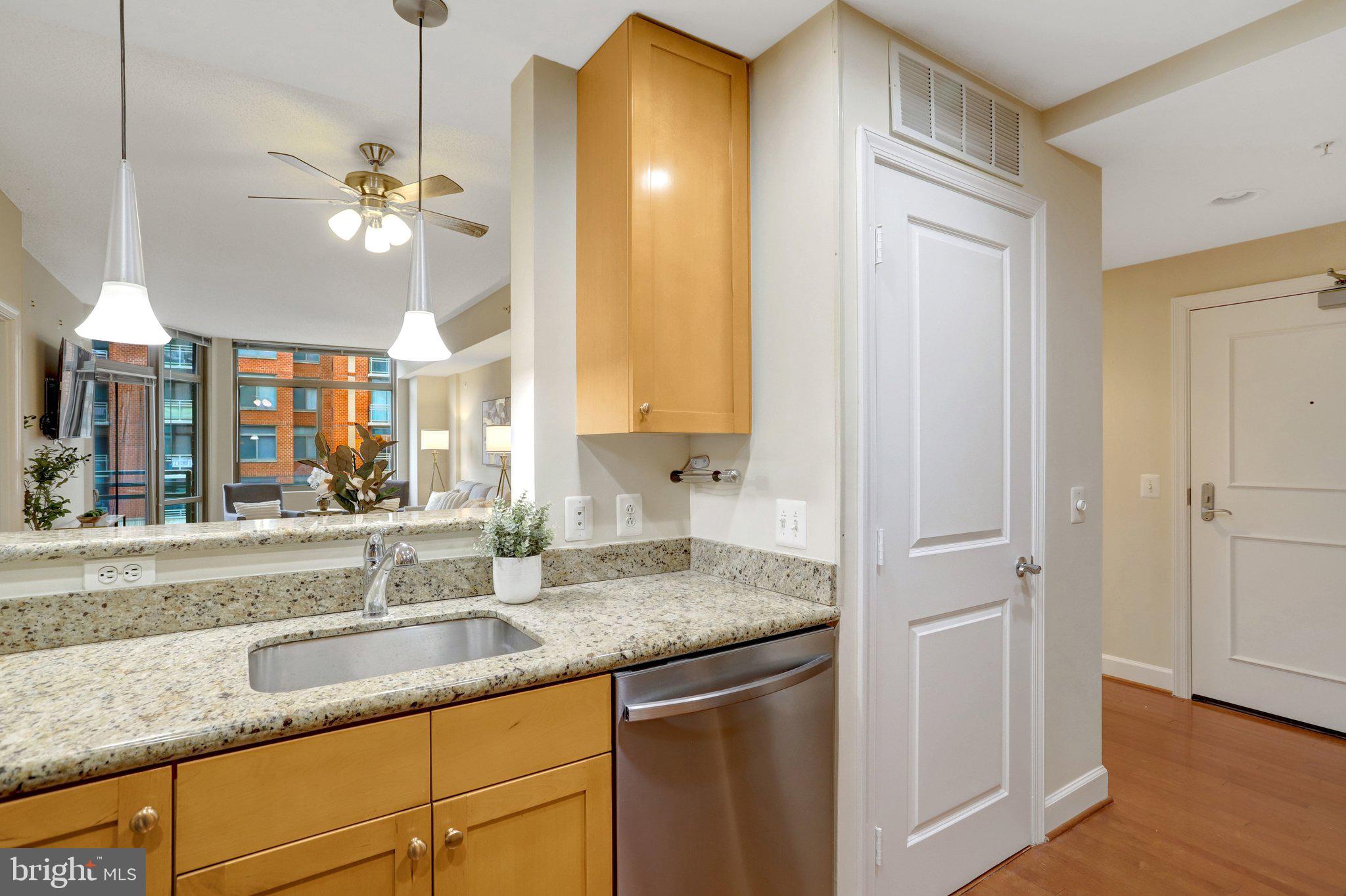 3650 South Glebe Road, Unit 442 Arlington, VA 22202 - Photo 18 of 54 a kitchen with stainless steel appliances granite countertop a sink a counter space and a window