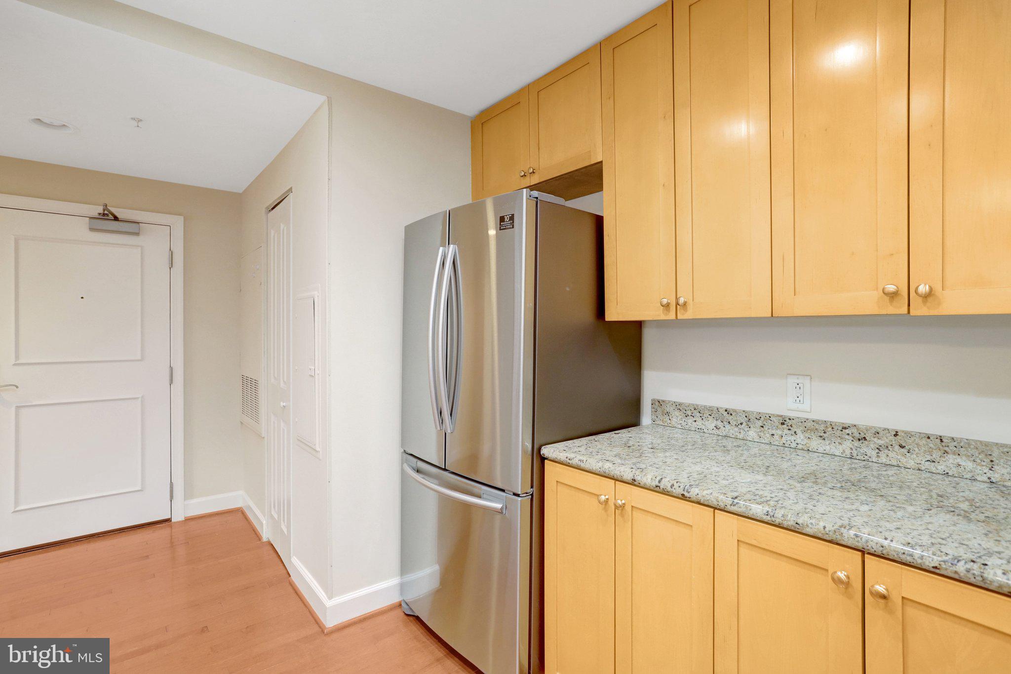 3650 South Glebe Road, Unit 442 Arlington, VA 22202 - Photo 19 of 54 a kitchen with stainless steel appliances granite countertop a refrigerator and a sink