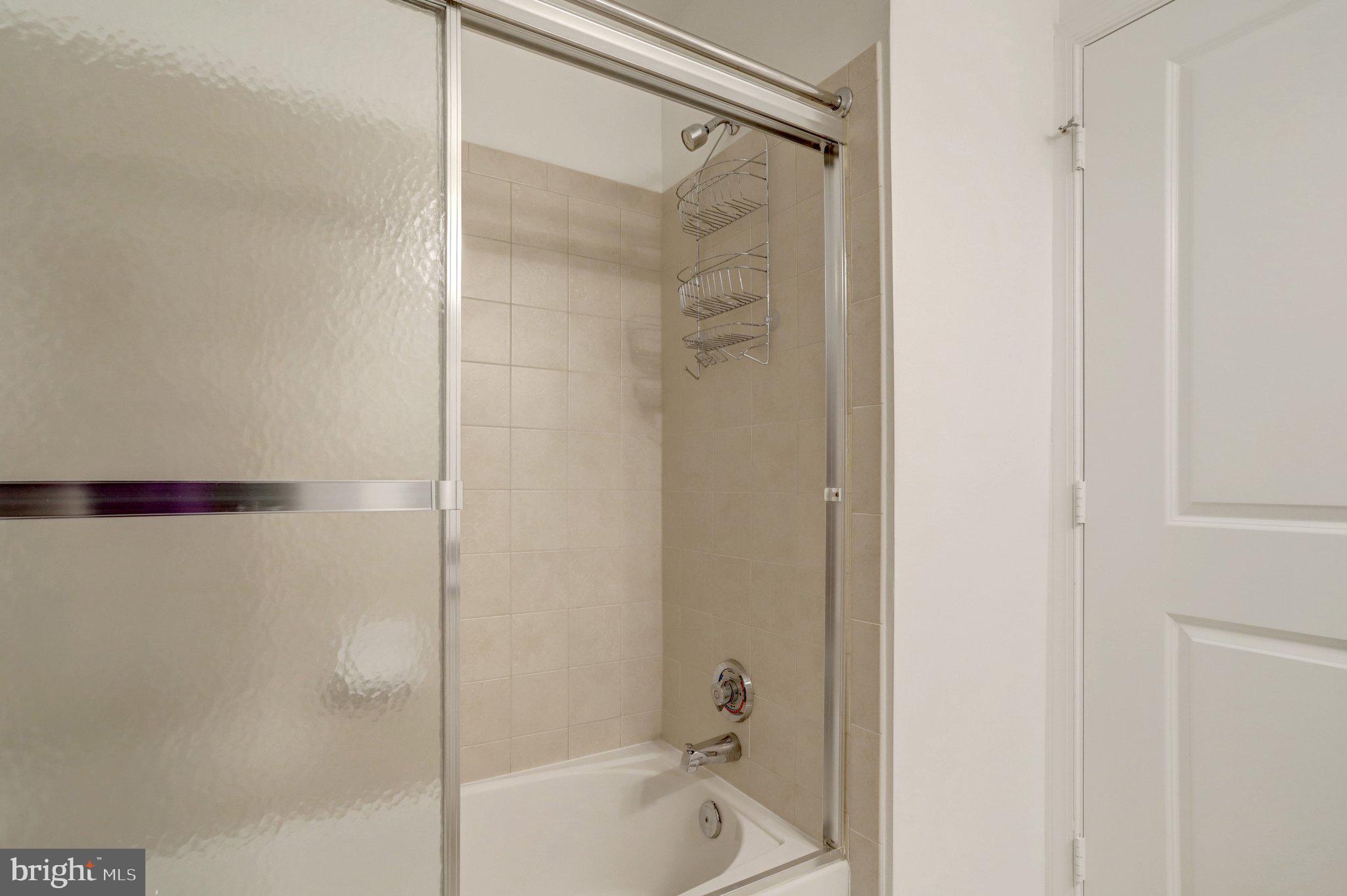 3650 South Glebe Road, Unit 442 Arlington, VA 22202 - Photo 23 of 54 a bathroom with a shower and a bath tub