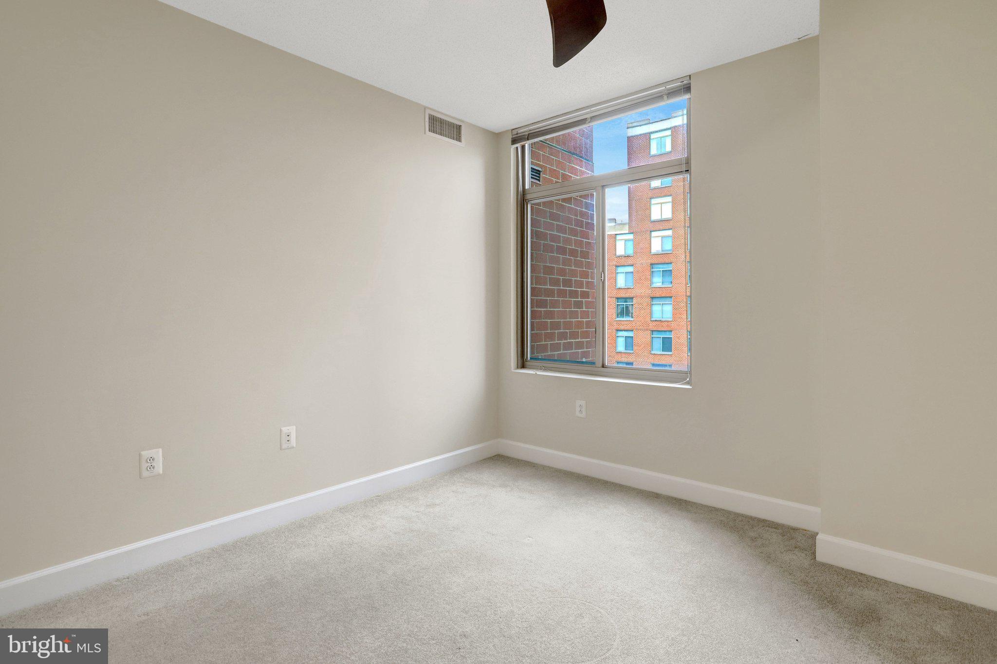 3650 South Glebe Road, Unit 442 Arlington, VA 22202 - Photo 27 of 54 an empty room with windows and closet