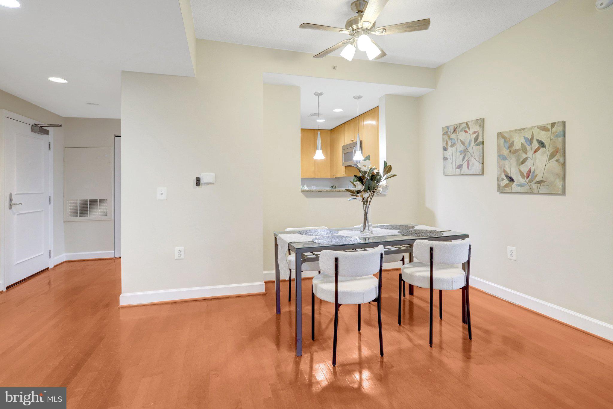 3650 South Glebe Road, Unit 442 Arlington, VA 22202 - Photo 6 of 54 a view of a dining room with furniture