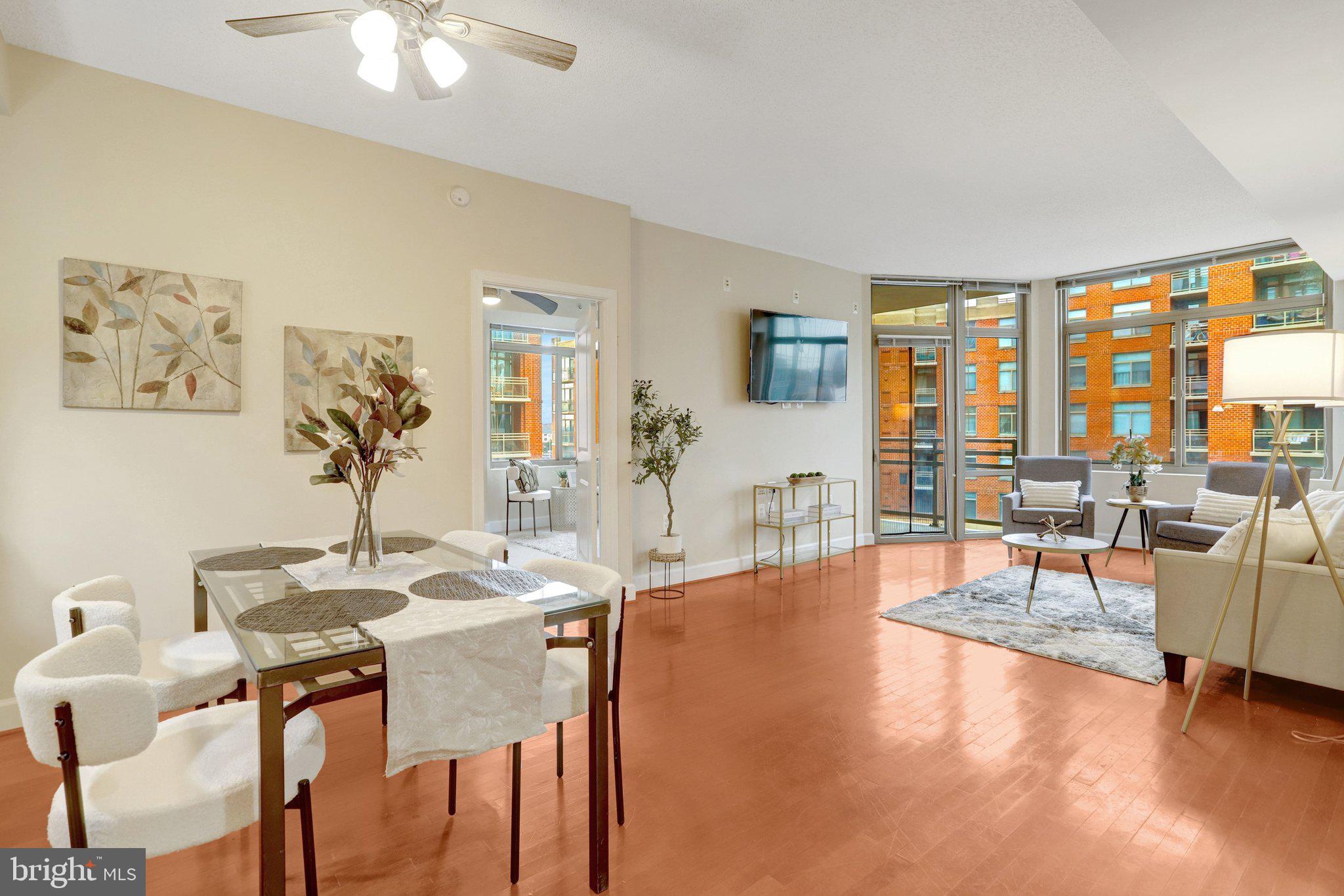 3650 South Glebe Road, Unit 442 Arlington, VA 22202 - Photo 9 of 54 a dining room with furniture and large windows
