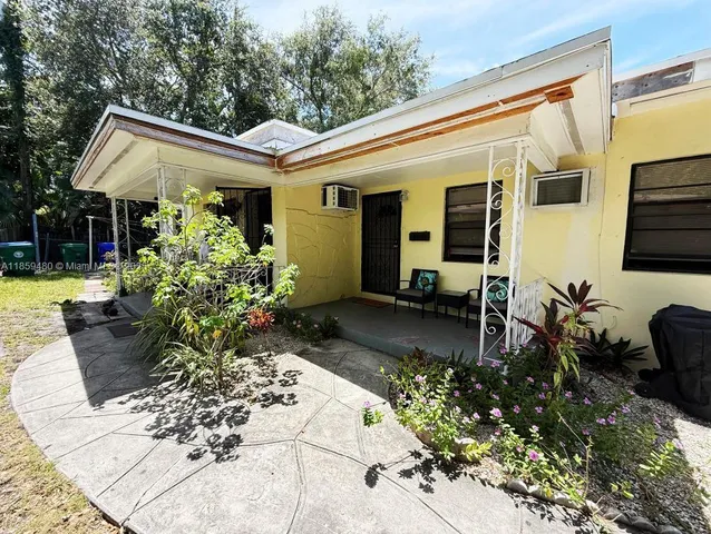 a view of house with patio outdoor seating