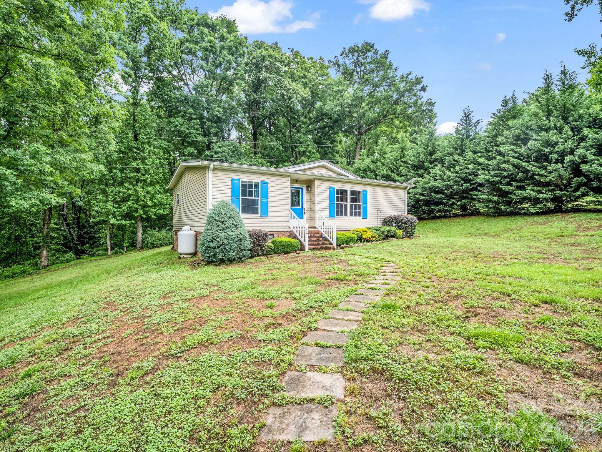 1449 Toney Road Bostic, NC 28018 - Photo 3 of 43 a house view with a garden space