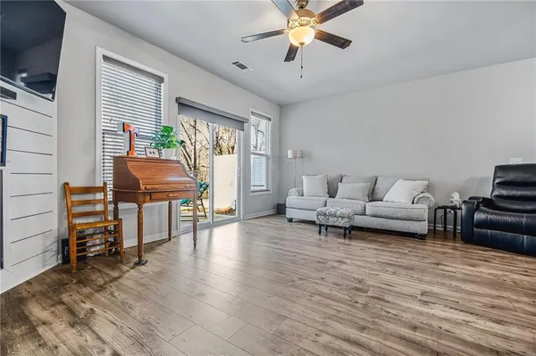 a living room with furniture and a large window
