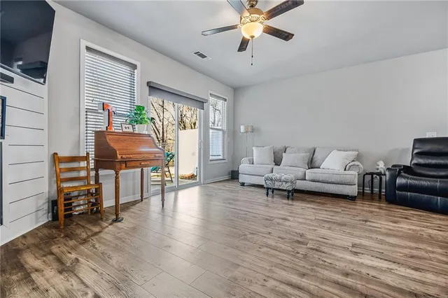 a living room with furniture and a large window