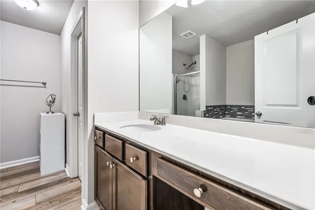 a bathroom with a sink and a mirror