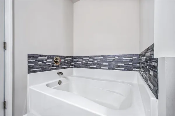 a bathroom with a bathtub
