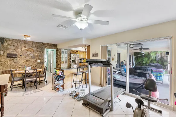 a view of a livingroom with furniture and a floor to ceiling window