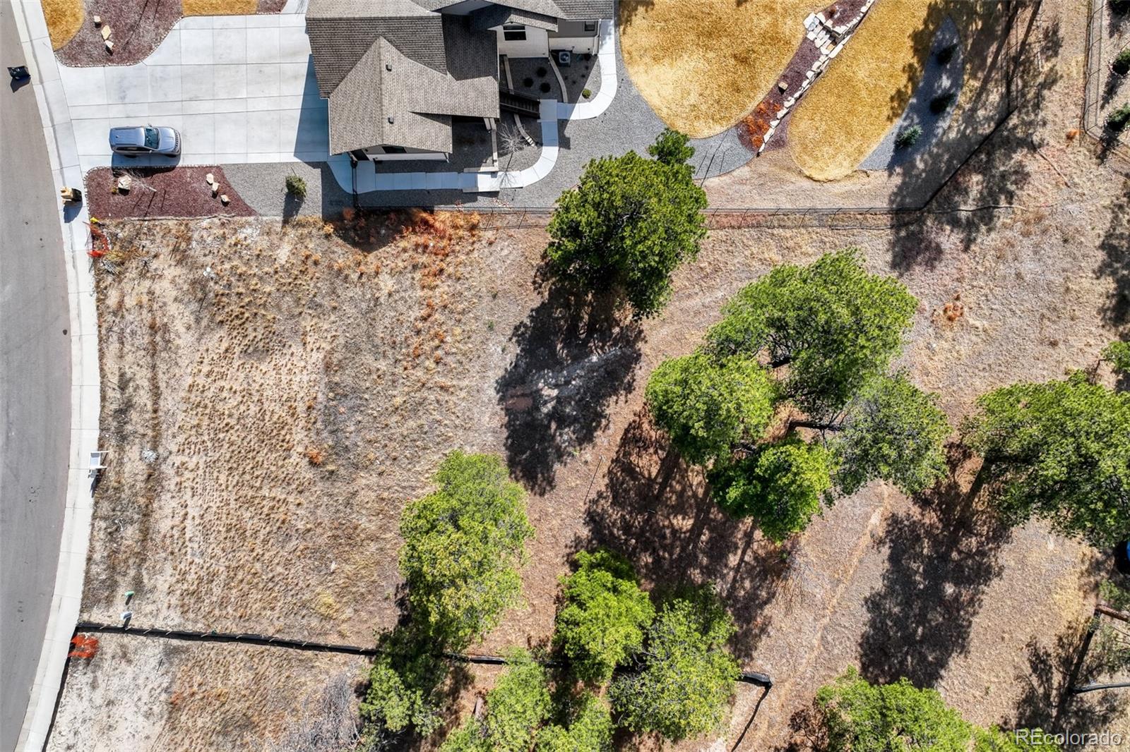 5805 Powell Road Parker, CO 80134 - Photo 7 of 11 an aerial view of houses with outdoor space