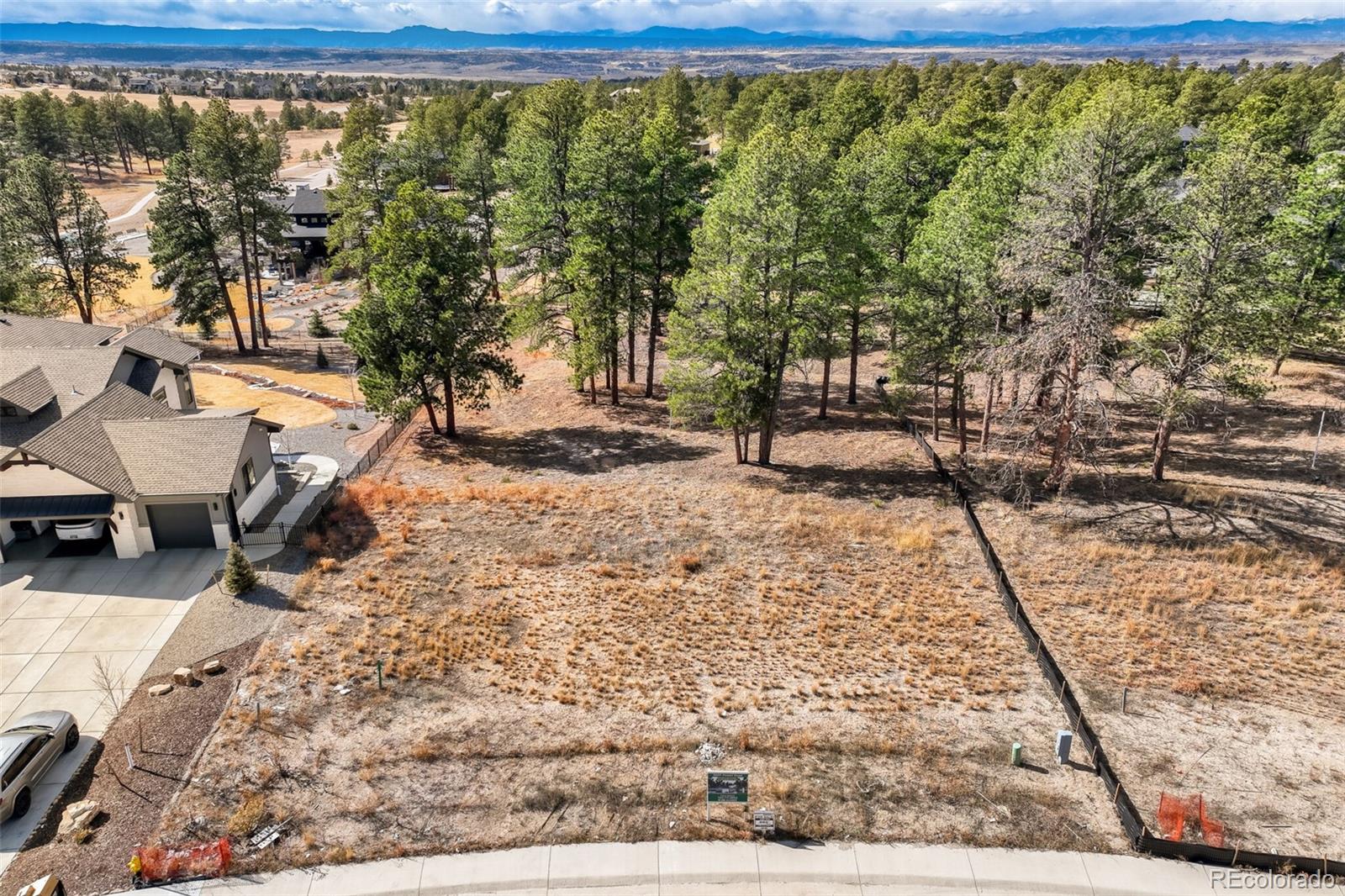 5805 Powell Road Parker, CO 80134 - Photo 10 of 11 a view of a yard with trees