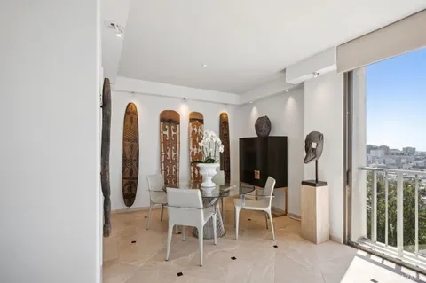 a view of a livingroom with furniture and entryway