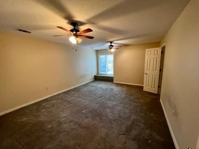1833 Allenby Green, Unit 1833 Germantown, TN 38139 - Photo 13 of 18 an empty room with a ceiling fan and a window