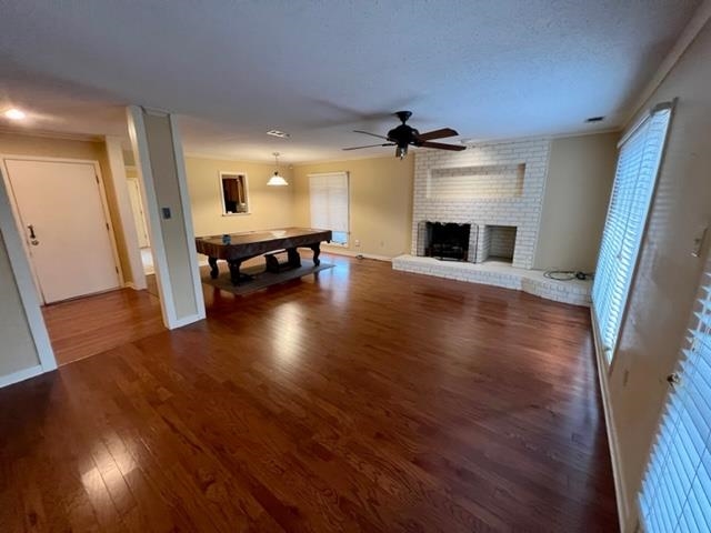 1833 Allenby Green, Unit 1833 Germantown, TN 38139 - Photo 4 of 18 wooden floor in an empty room with a fireplace