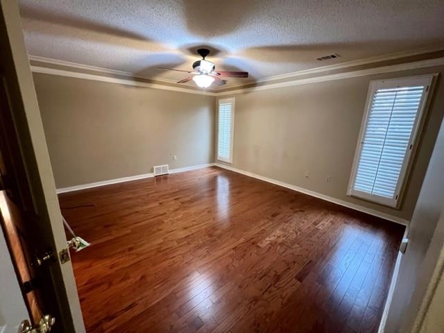 1833 Allenby Green, Unit 1833 Germantown, TN 38139 - Photo 7 of 18 a view of an empty room with wooden floor and a window