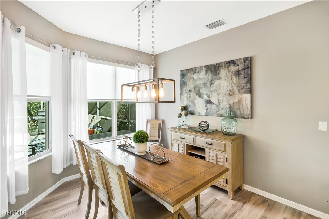 15047 Balmoral Loop Fort Myers, FL 33919 - Photo 12 of 37 a view of a dining room with furniture window and outside view