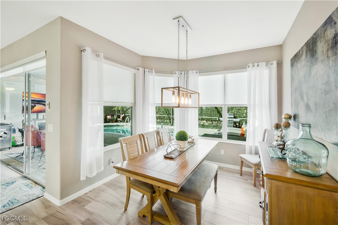 15047 Balmoral Loop Fort Myers, FL 33919 - Photo 13 of 37 a view of a dining room with furniture window and outside view