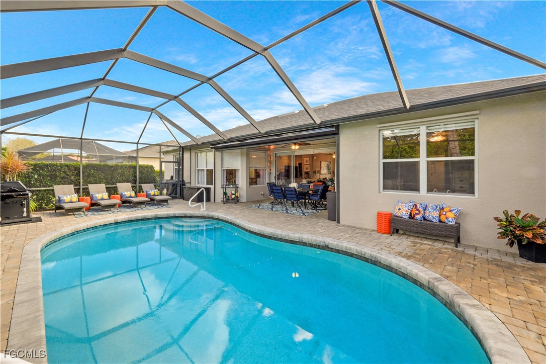 15047 Balmoral Loop Fort Myers, FL 33919 - Photo 24 of 37 a view of a swimming pool with a patio