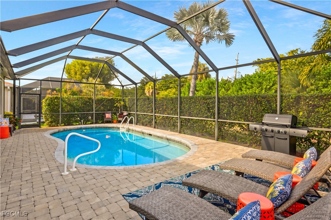 15047 Balmoral Loop Fort Myers, FL 33919 - Photo 25 of 37 a view of a swimming pool with a patio