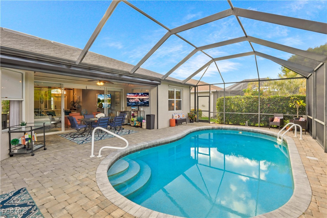 15047 Balmoral Loop Fort Myers, FL 33919 - Photo 26 of 37 a view of a swimming pool with chairs