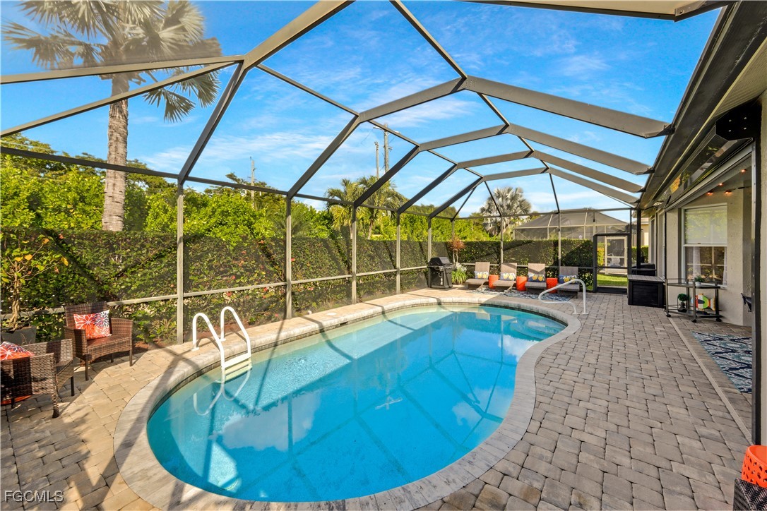 15047 Balmoral Loop Fort Myers, FL 33919 - Photo 28 of 37 a view of a swimming pool with a patio