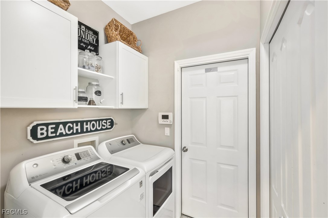 15047 Balmoral Loop Fort Myers, FL 33919 - Photo 31 of 37 a utility room with dryer and washer