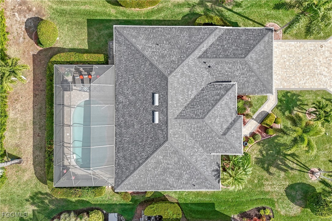 15047 Balmoral Loop Fort Myers, FL 33919 - Photo 36 of 37 front view of a brick house with a yard