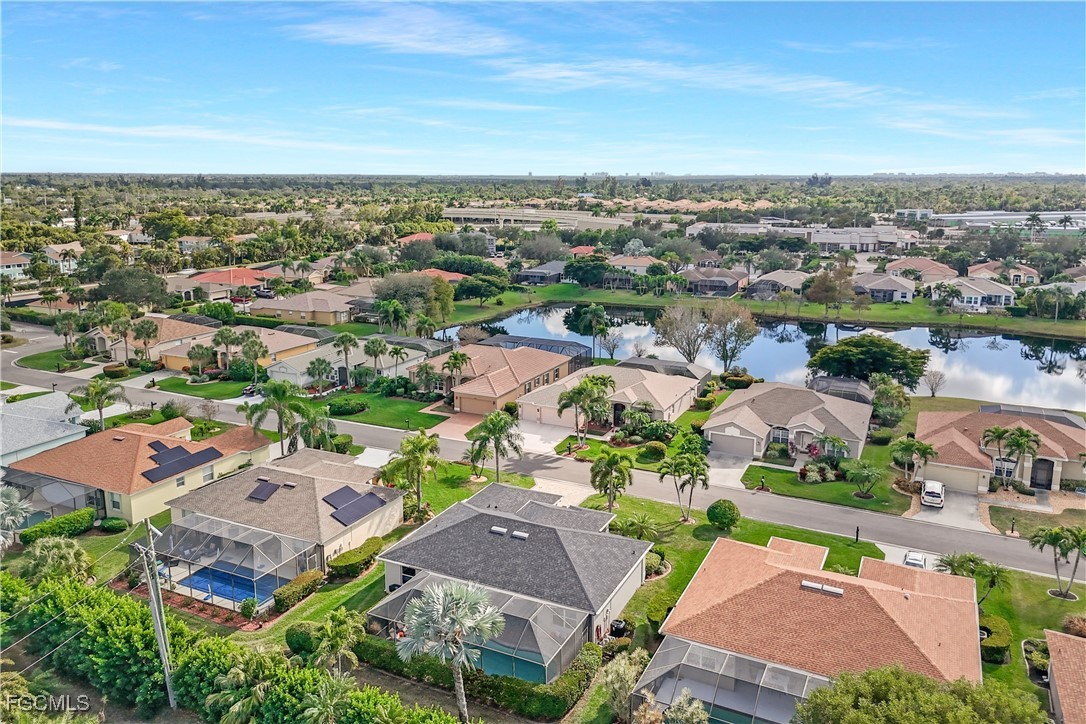 15047 Balmoral Loop Fort Myers, FL 33919 - Photo 37 of 37 an aerial view of a city with lots of residential buildings and mountain view in back