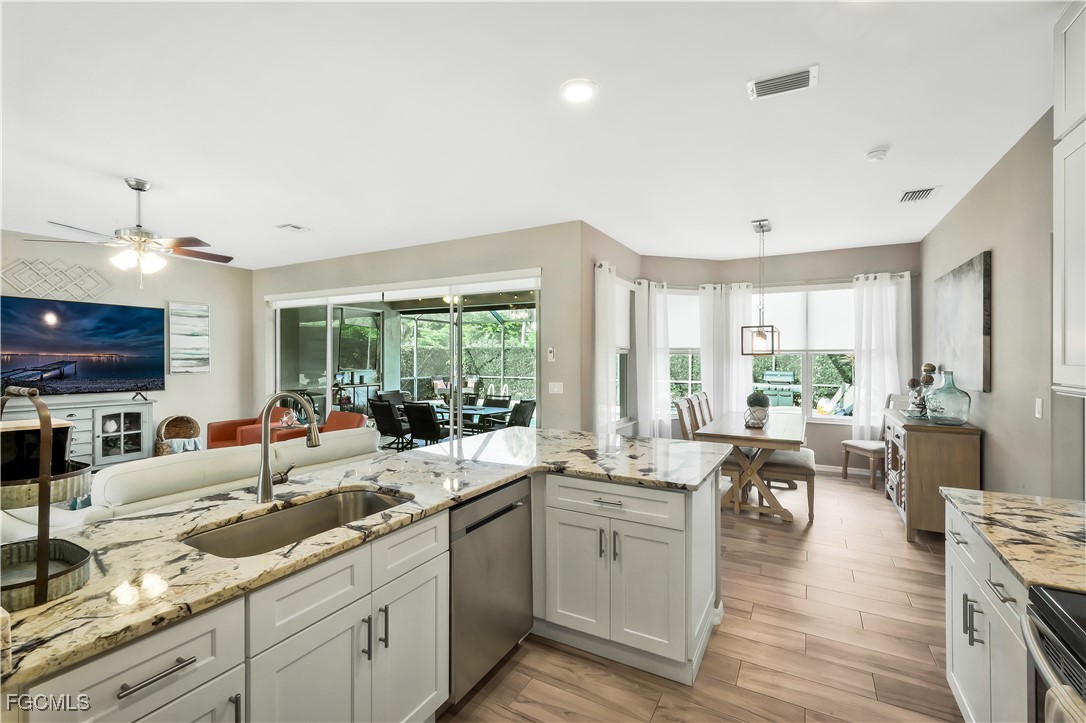 15047 Balmoral Loop Fort Myers, FL 33919 - Photo 10 of 37 a large white kitchen with lots of counter top space