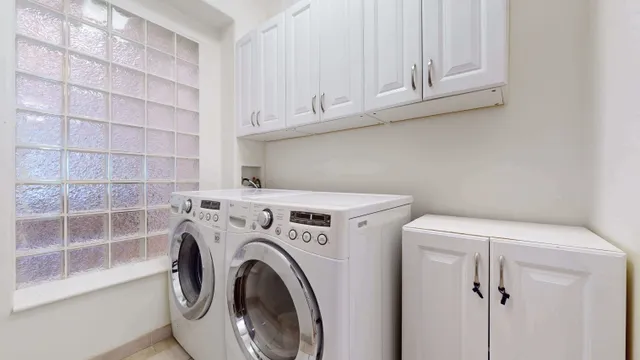 a bathroom with a toilet sink vanity and shower