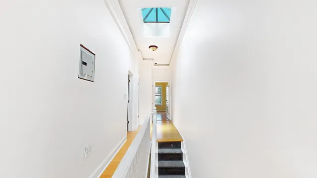 a bathroom with a granite countertop sink a toilet and a mirror