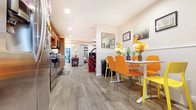 a kitchen with stainless steel appliances granite countertop a refrigerator and a stove